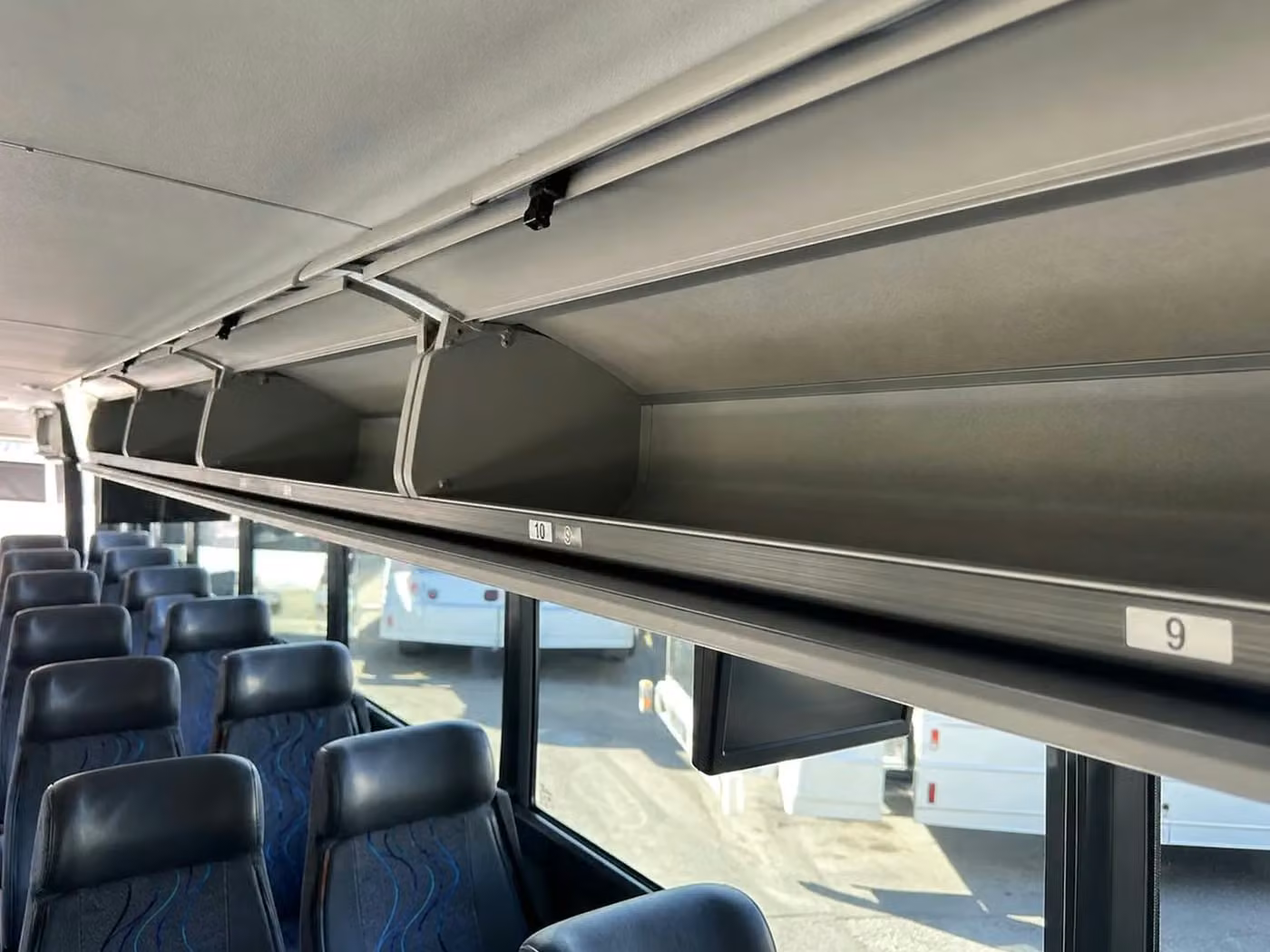 greenfield charter bus overhead storage
